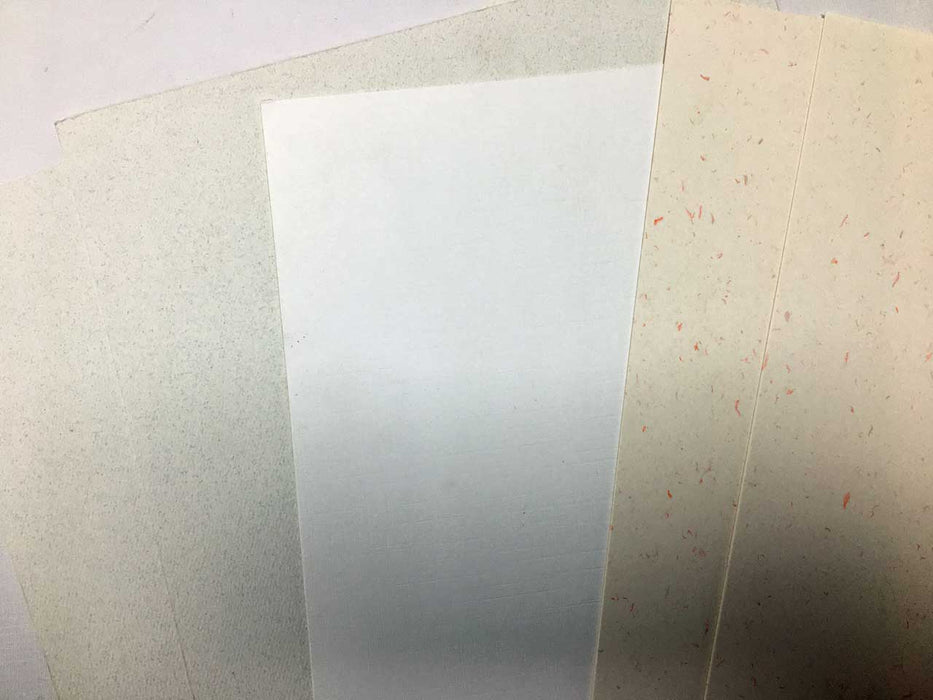 Sheets of embossed and speckle card