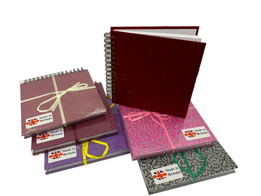 Six square spiral sketchbooks with Indian handmade paper covers