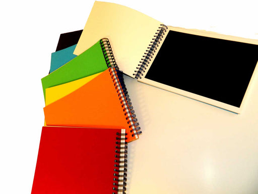 Selection of Wingate Journals with assorted colour covers.