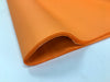A fold of orange tissue paper
