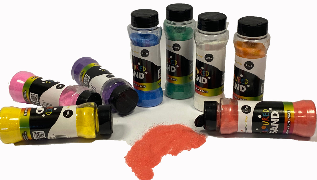 Eight bottles of coloured sand