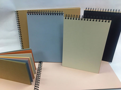 An array of Earthtone spiral sketchbooks