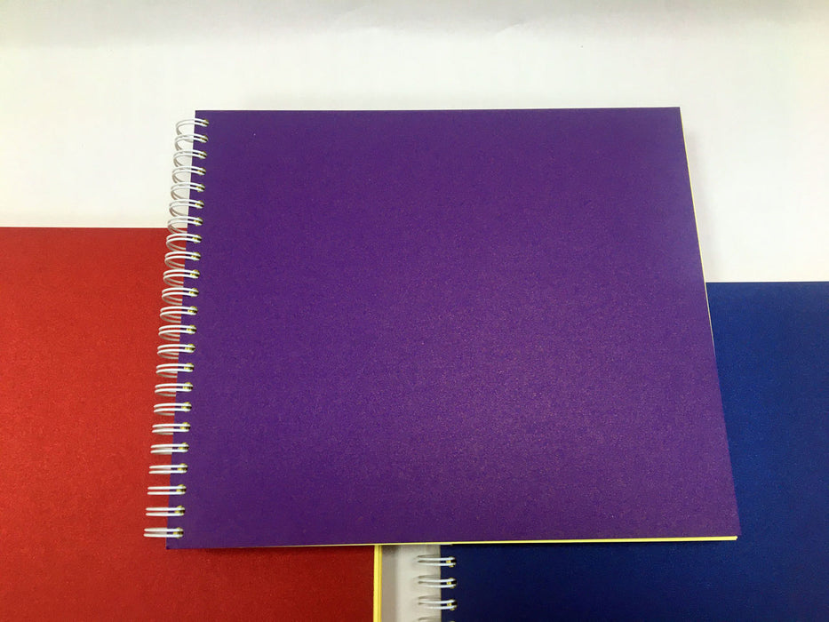 Spiral pads showing purple cover