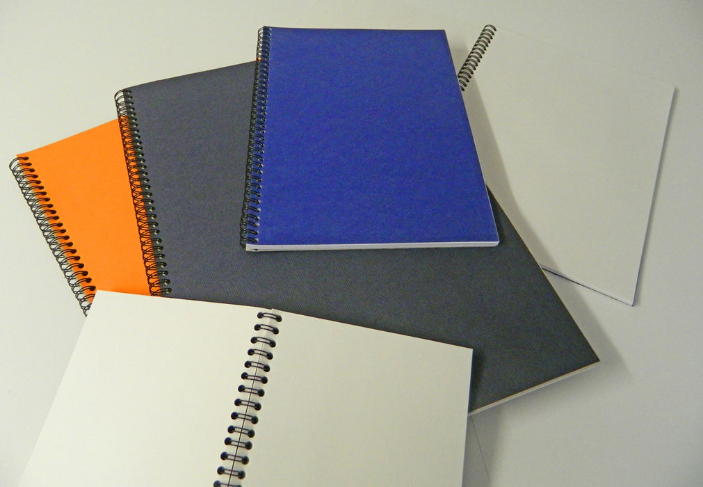 Spiral bound sketchbooks with varying colour covers
