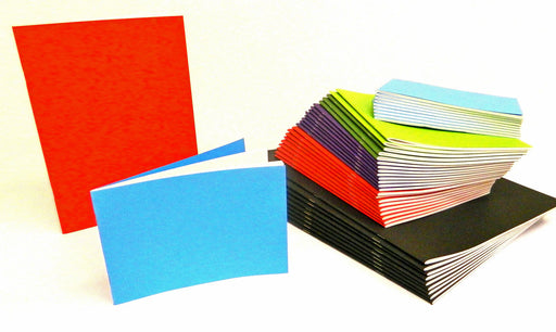 Stack of stapled sketch books in assorted colours