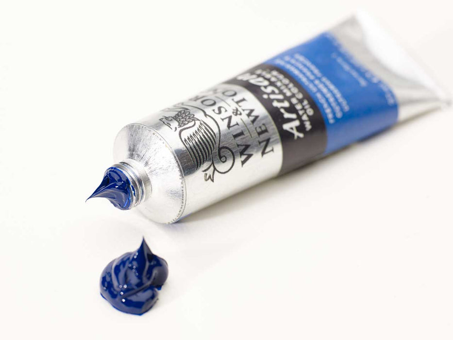 Open tube of blue artist oil paint