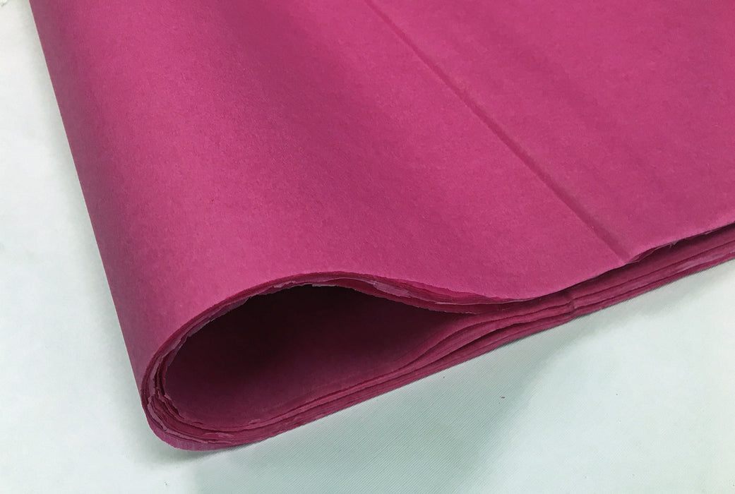 A fold of burgundy coloured tissue paper