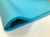A fold of sky blue tissue paper